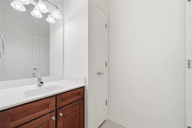 a spacious bedroom with a bed and a ceiling fan