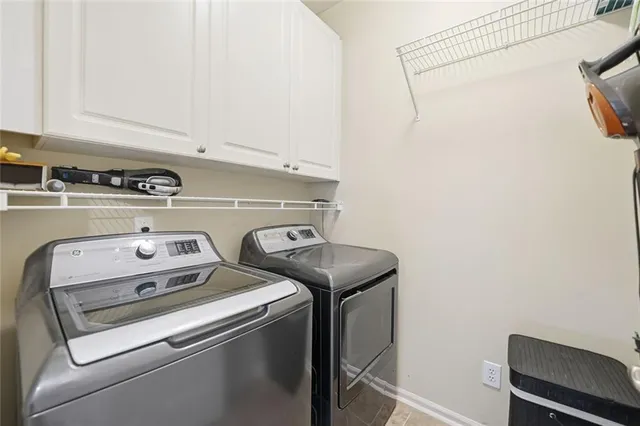 a bathroom with a tub a sink and mirror