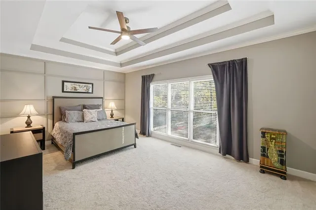 a spacious bathroom with a tub a double vanity sink and a mirror
