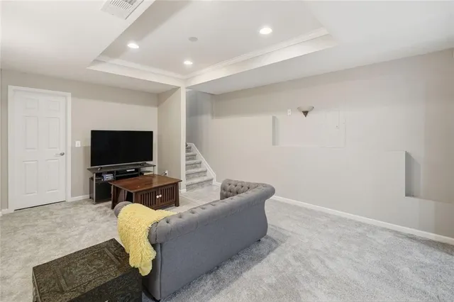 a bathroom with a sink a toilet a mirror and shower