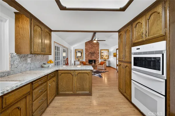 a kitchen with sink cabinets and stove