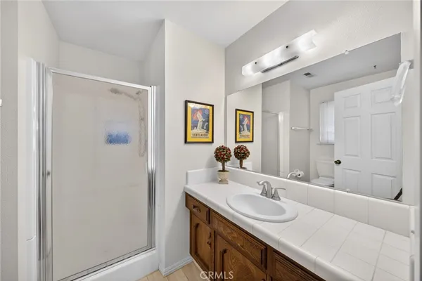 a bathroom with a sink double vanity and a mirror