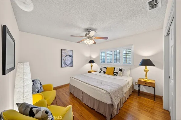 a bedroom with bed and a window