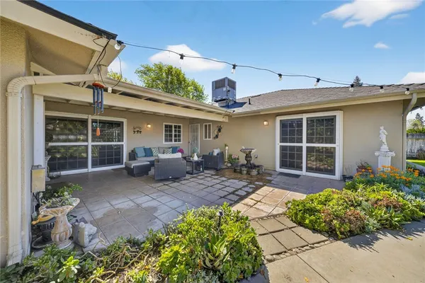 a front view of a house with garden