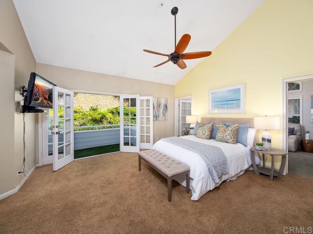 960 Valley Avenue Solana Beach, CA 92075 - Photo 19 of 51 a spacious bedroom with a bed mirror and window