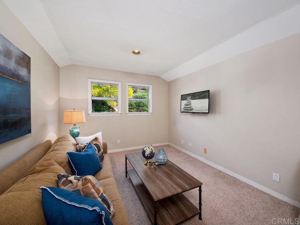 960 Valley Avenue Solana Beach, CA 92075 - Photo 31 of 51 a living room with furniture and a flat screen tv