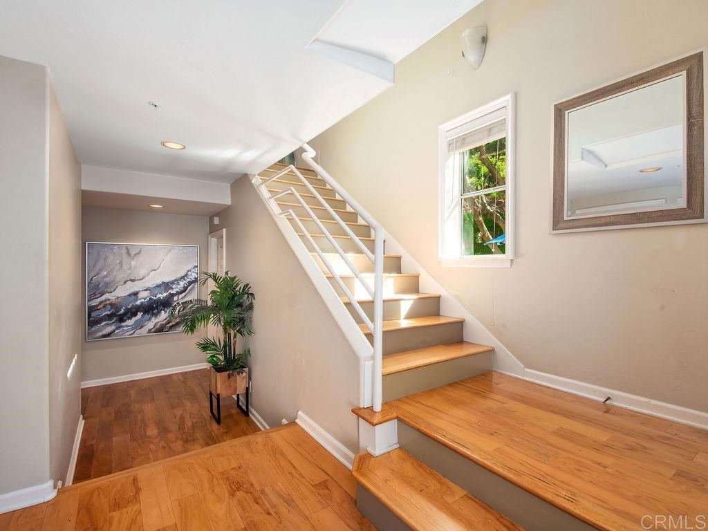 960 Valley Avenue Solana Beach, CA 92075 - Photo 36 of 51 a view of an entryway with wooden floor and a potted plant