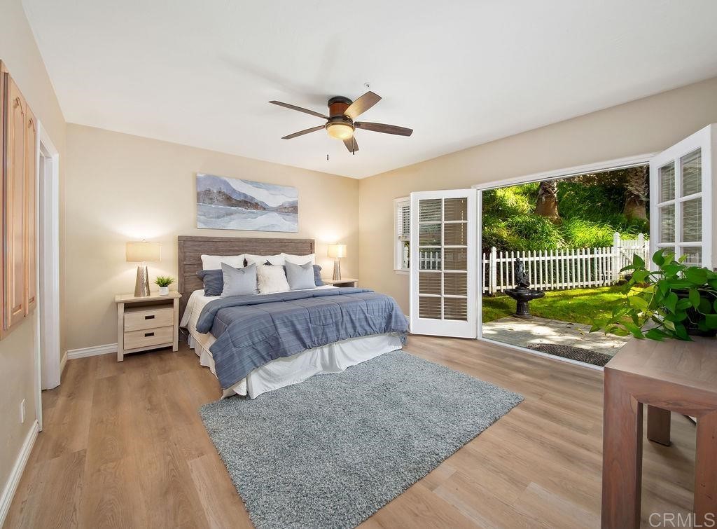 960 Valley Avenue Solana Beach, CA 92075 - Photo 42 of 51 a bedroom with a bed and a large window