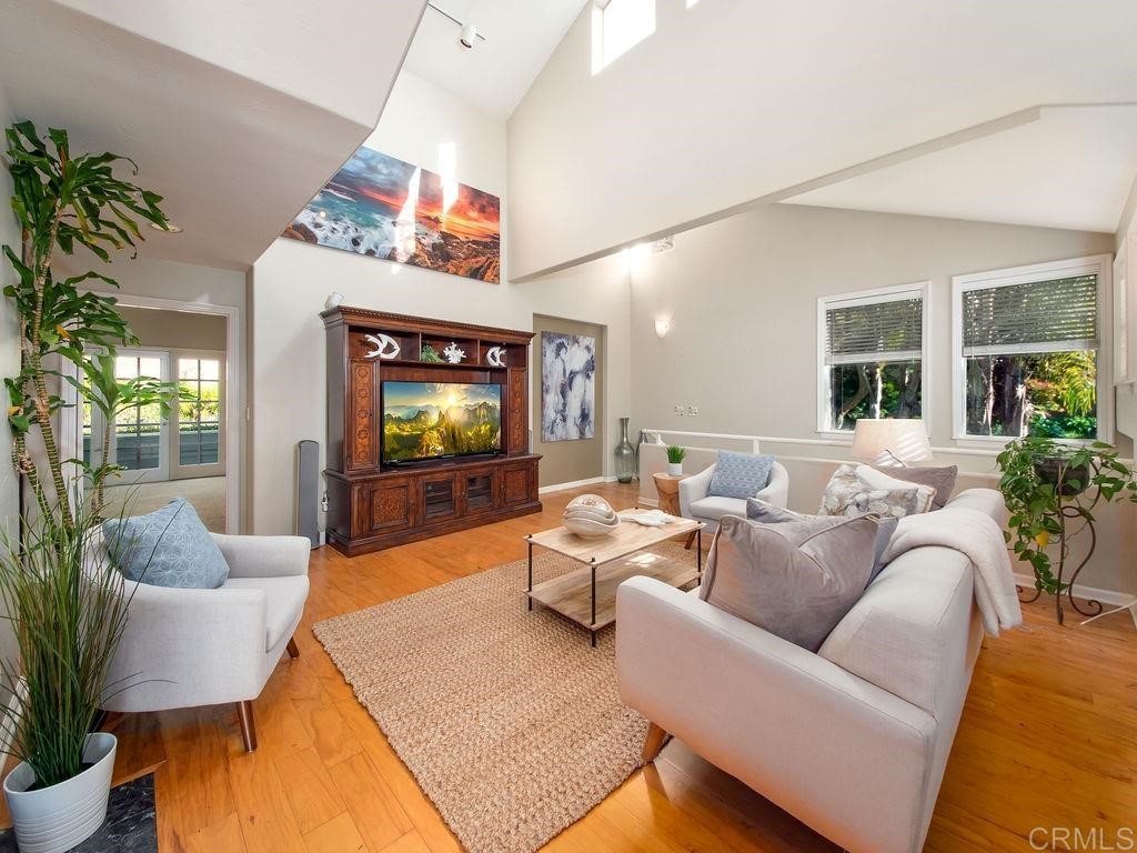 960 Valley Avenue Solana Beach, CA 92075 - Photo 7 of 51 a living room with furniture and a flat screen tv