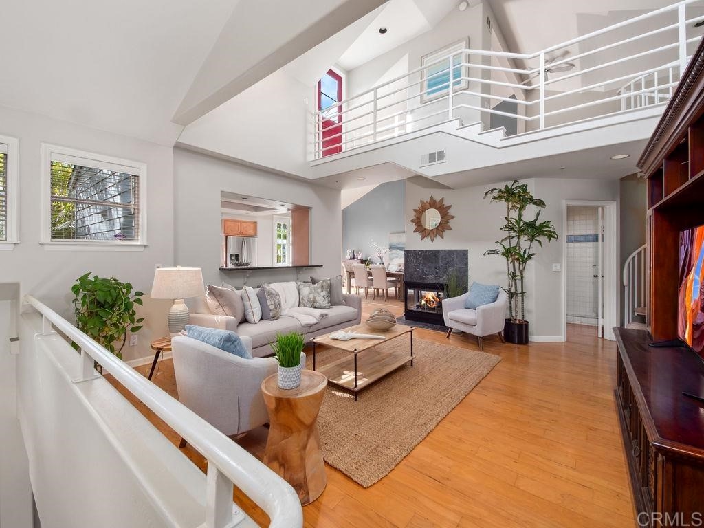 960 Valley Avenue Solana Beach, CA 92075 - Photo 8 of 51 a living room with fireplace furniture and a flat screen tv