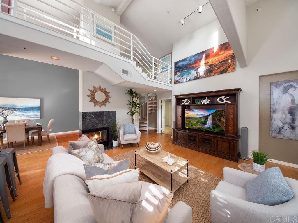 960 Valley Avenue Solana Beach, CA 92075 - Photo 9 of 51 a living room with furniture and a flat screen tv