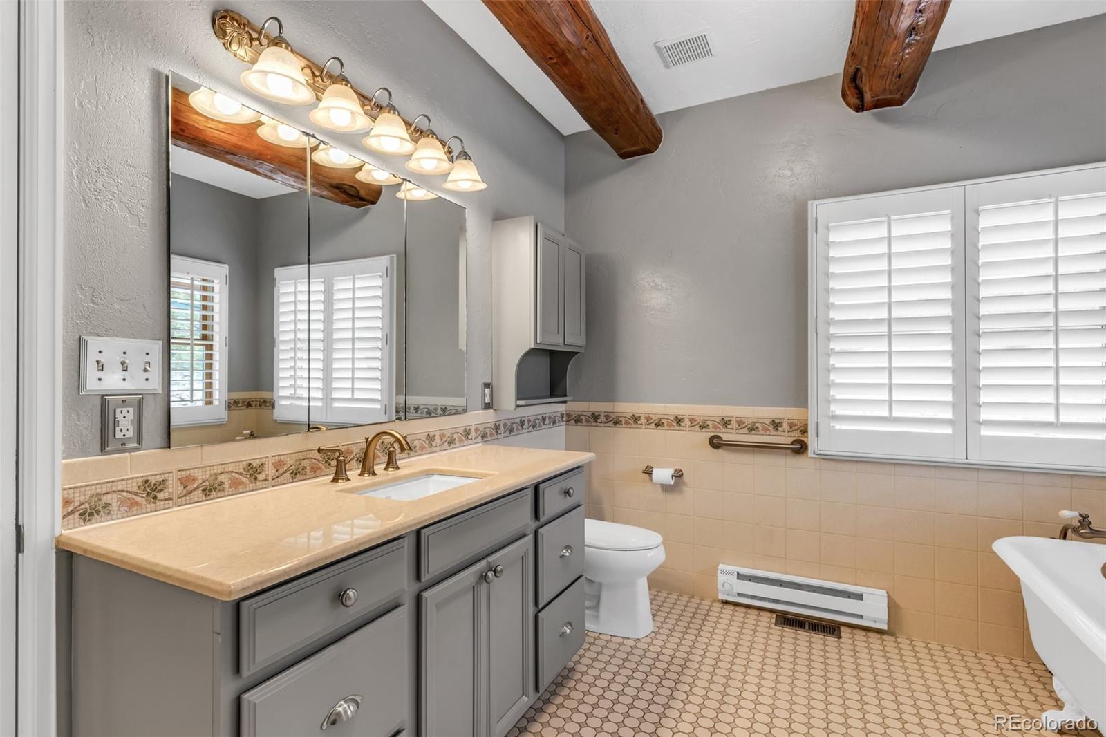 4230 Timber Ridge Road Westcliffe, CO 81252 - Photo 17 of 37 a bathroom with a sink double vanity and a bathtub