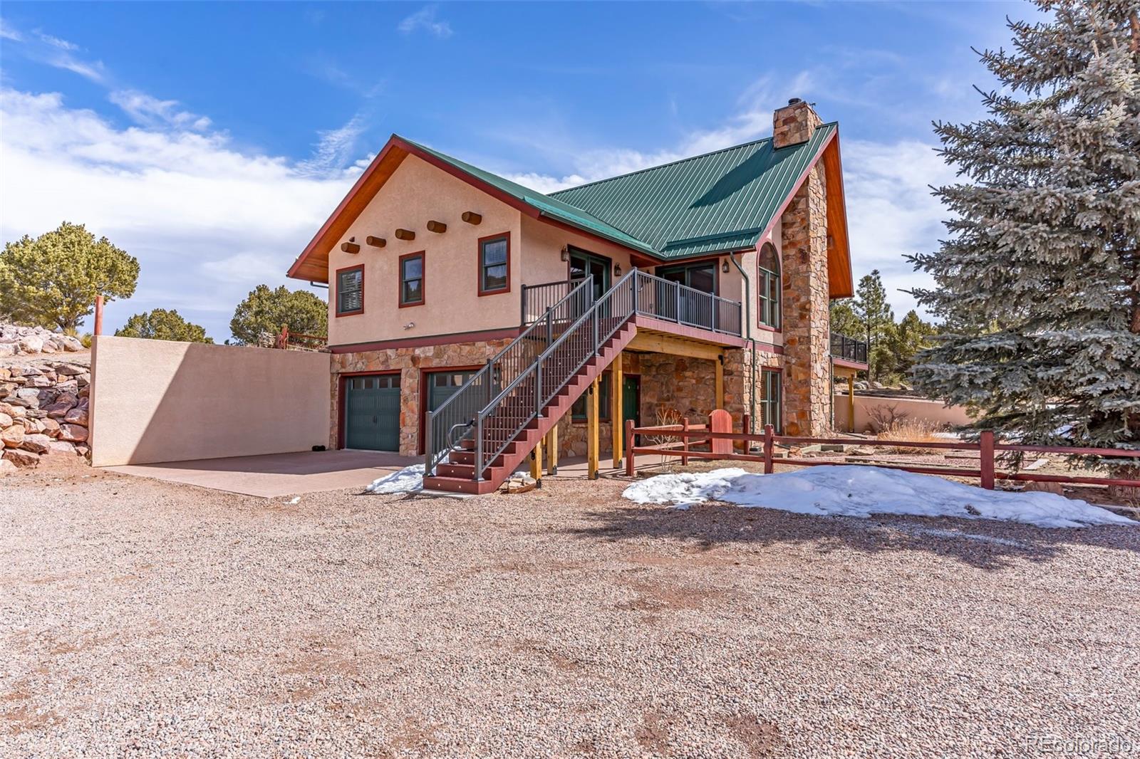 4230 Timber Ridge Road Westcliffe, CO 81252 - Photo 25 of 37 a view of a house with wooden fence