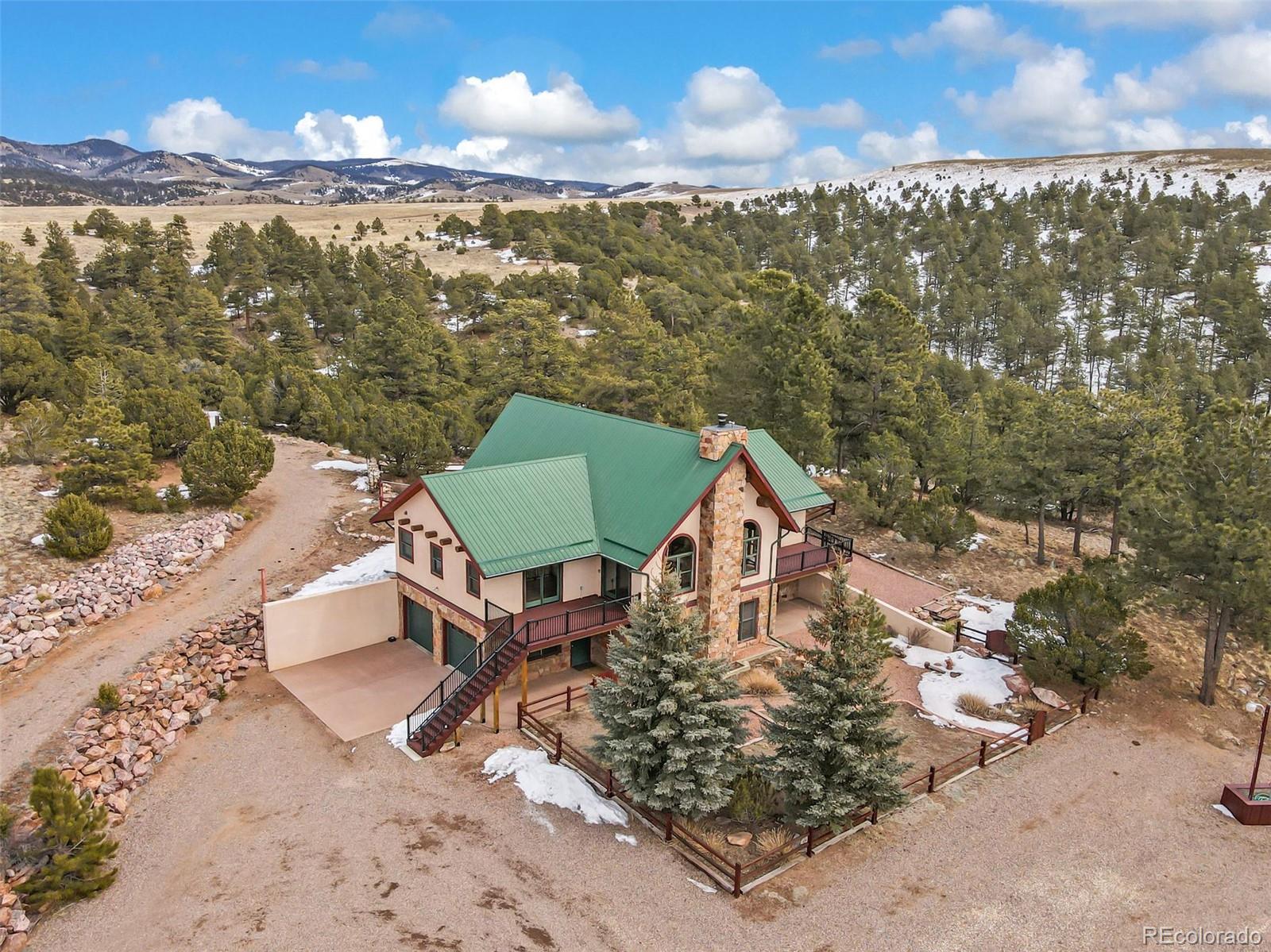 4230 Timber Ridge Road Westcliffe, CO 81252 - Photo 36 of 37 a view of a terrace with wooden floor and a yard