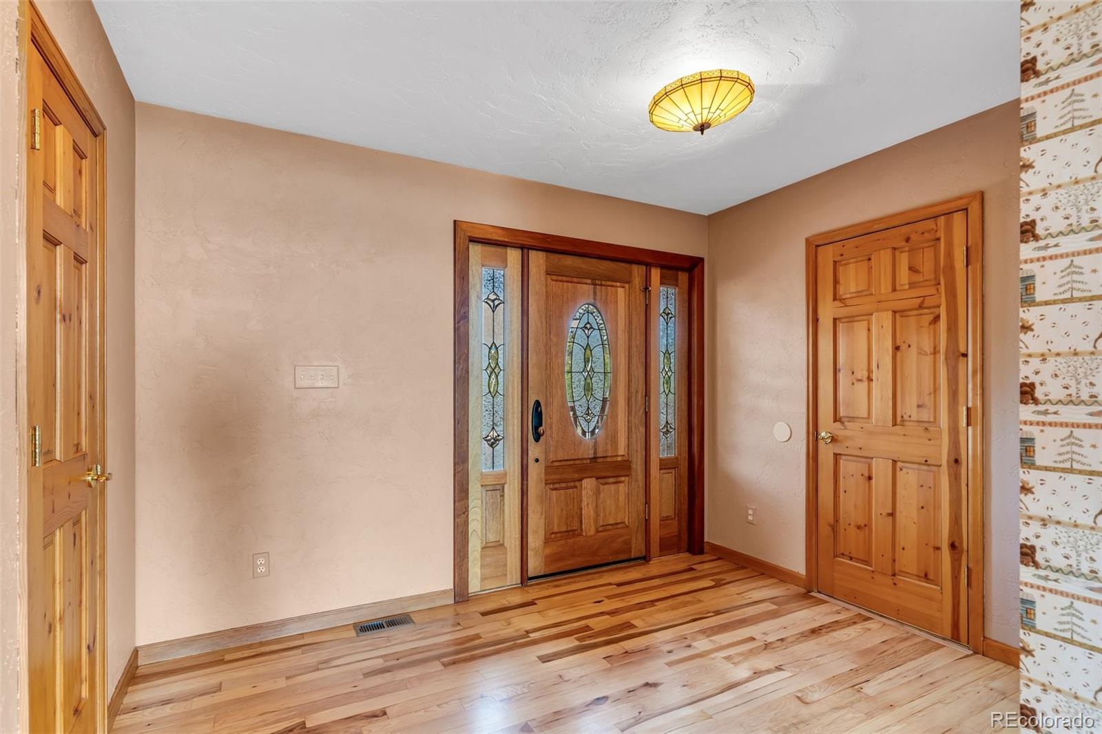 4230 Timber Ridge Road Westcliffe, CO 81252 - Photo 4 of 37 a view of an entryway with wooden floor