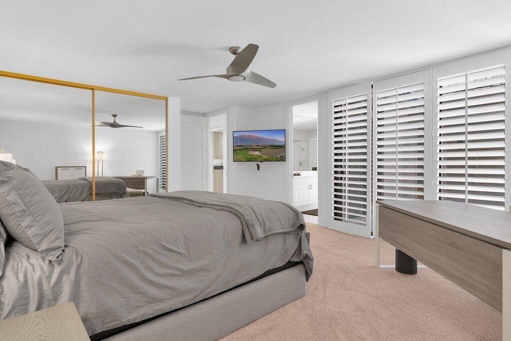 6 Barnard Court Rancho Mirage, CA 92270 - Photo 12 of 50 a spacious bedroom with a bed and a large window