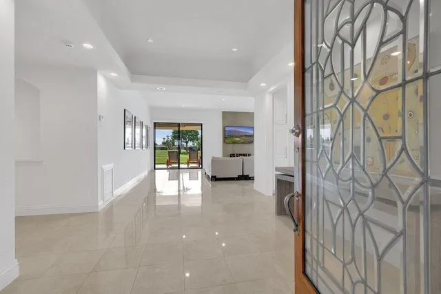 a bed room with a bed and a large window