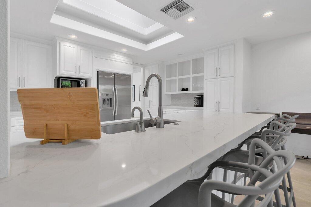 6 Barnard Court Rancho Mirage, CA 92270 - Photo 21 of 50 a kitchen with furniture and a large window