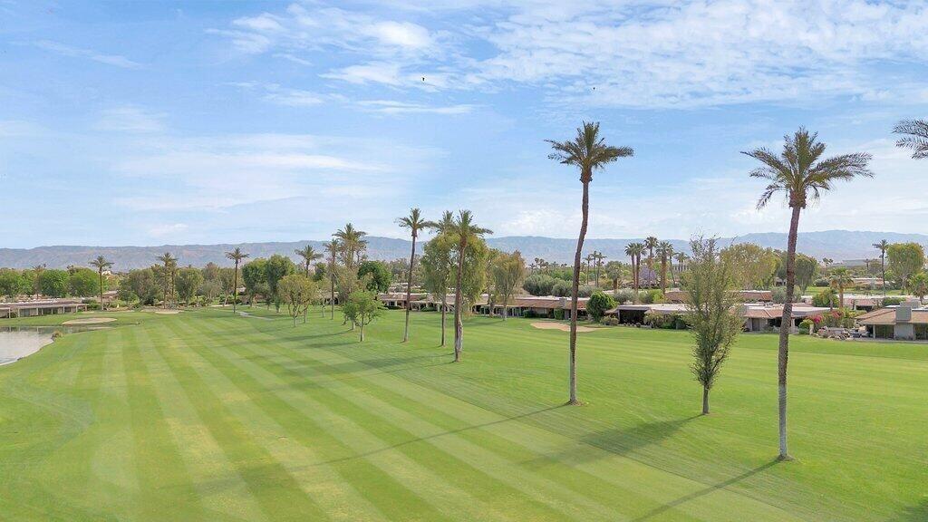 6 Barnard Court Rancho Mirage, CA 92270 - Photo 23 of 50 a view of a golf course with a lake view