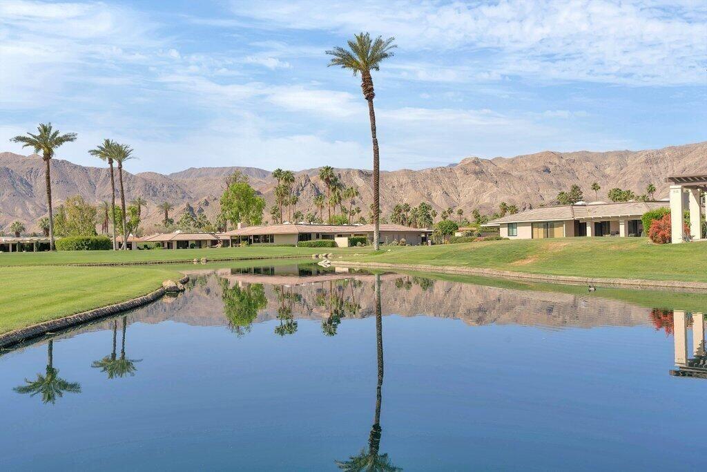 6 Barnard Court Rancho Mirage, CA 92270 - Photo 26 of 50 a view of a lake with a big yard