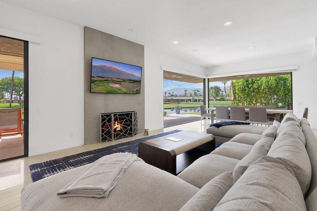 6 Barnard Court Rancho Mirage, CA 92270 - Photo 29 of 50 a living room with furniture and a fireplace