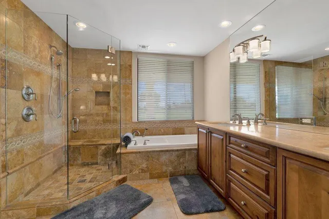 a bedroom with a large bed and a large window