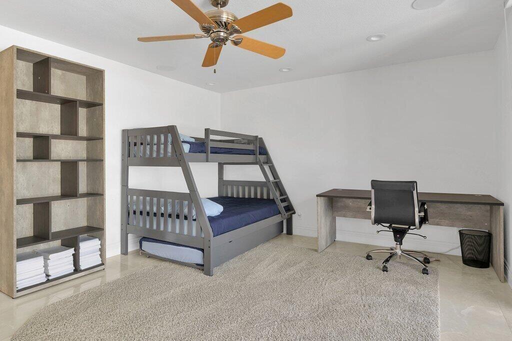 6 Barnard Court Rancho Mirage, CA 92270 - Photo 34 of 50 a bedroom with furniture and a ceiling fan