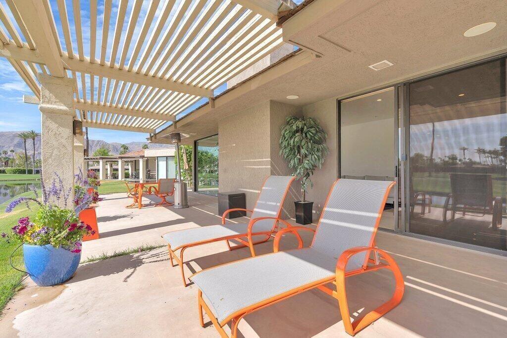 6 Barnard Court Rancho Mirage, CA 92270 - Photo 35 of 50 a outdoor space with chairs and potted plants