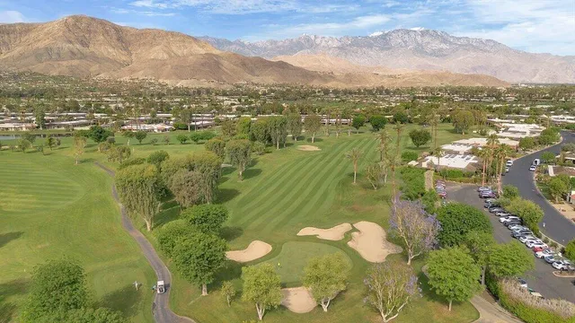 a view of a city with mountains in the background