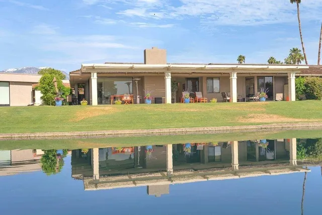 a view of a garden with swimming pool
