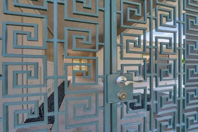 a bathroom with a toilet a sink a mirror and vanity