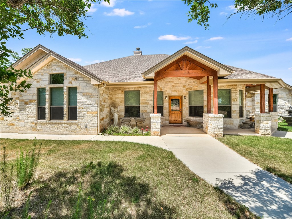 752 Beauchamp Road Dripping Springs, TX 78620 - Photo 1 of 1 a view of a house with yard and deck