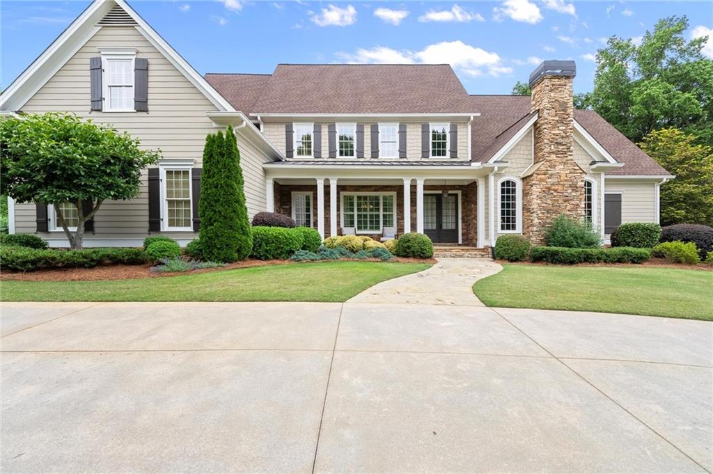 322 Edwards Brook Lane Canton, GA 30115 - Photo 6 of 99 a front view of house with yard and green space