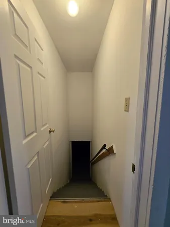a bathroom with a sink toilet and a mirror