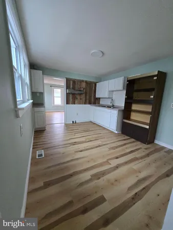 a bedroom with a bed and a television