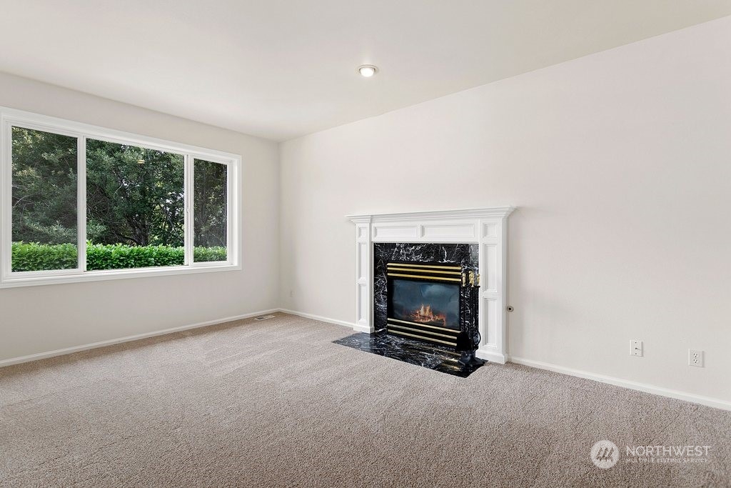 1315 231st Street Southeast Bothell, WA 98021 - Photo 16 of 34 a view of empty room with a fireplace