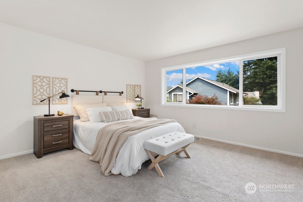 1315 231st Street Southeast Bothell, WA 98021 - Photo 17 of 34 a bedroom with bed and a window