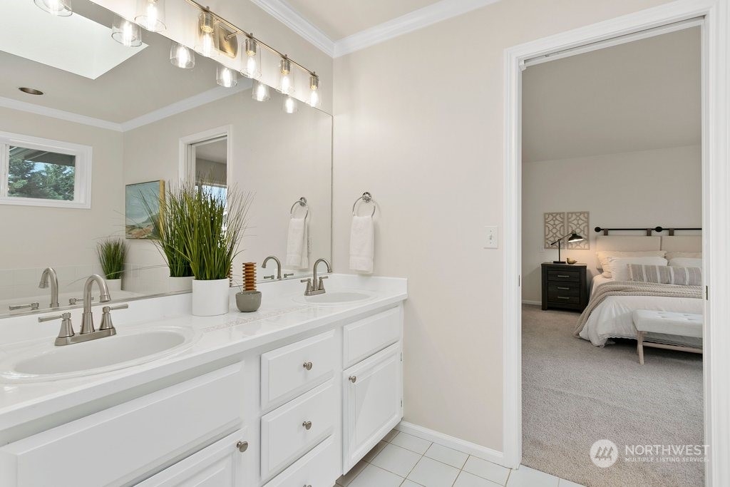 1315 231st Street Southeast Bothell, WA 98021 - Photo 20 of 34 a en suite bathroom with double sink and a mirror