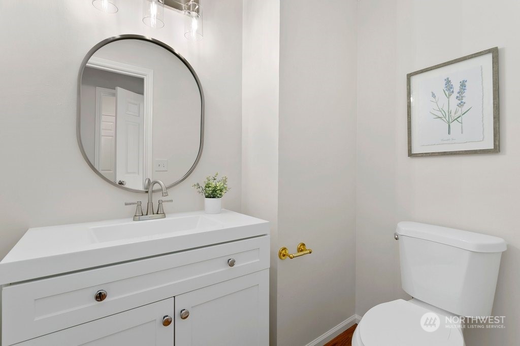 1315 231st Street Southeast Bothell, WA 98021 - Photo 24 of 34 a bathroom with a toilet a sink and mirror