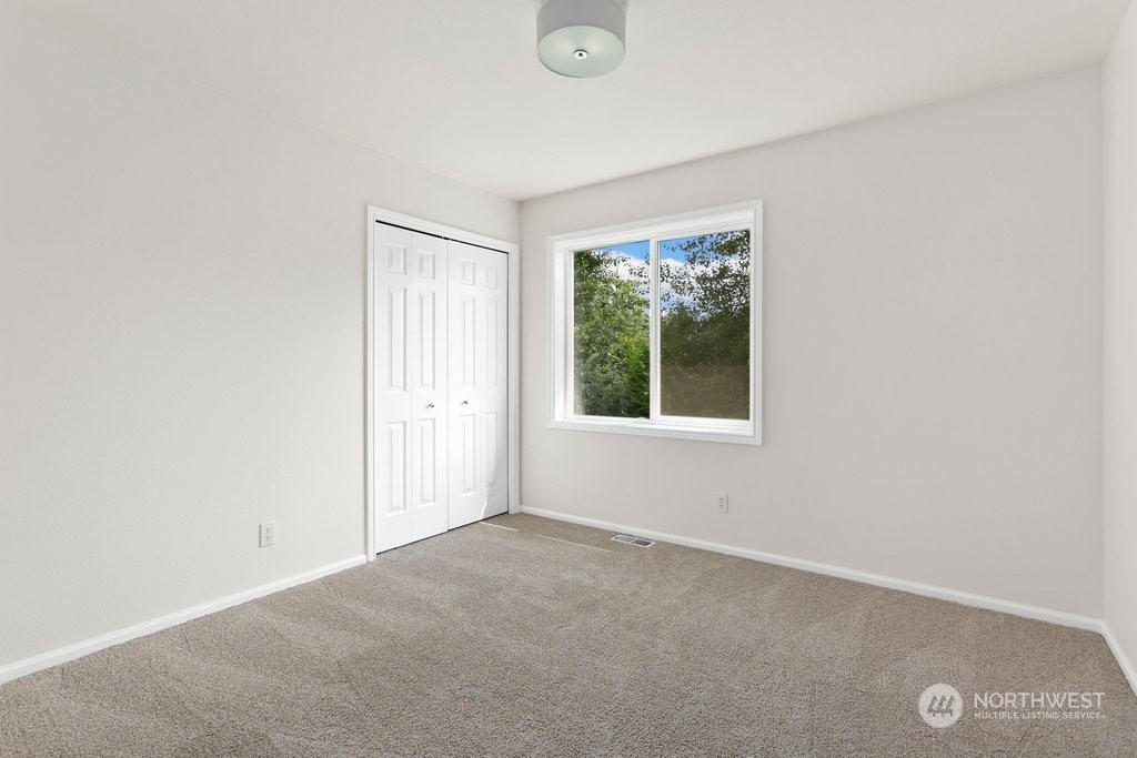 1315 231st Street Southeast Bothell, WA 98021 - Photo 28 of 34 an empty room with a window