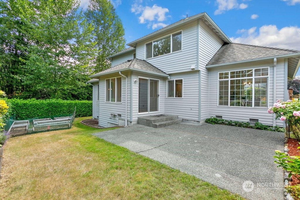 1315 231st Street Southeast Bothell, WA 98021 - Photo 31 of 34 a view of a house with a yard and sitting area
