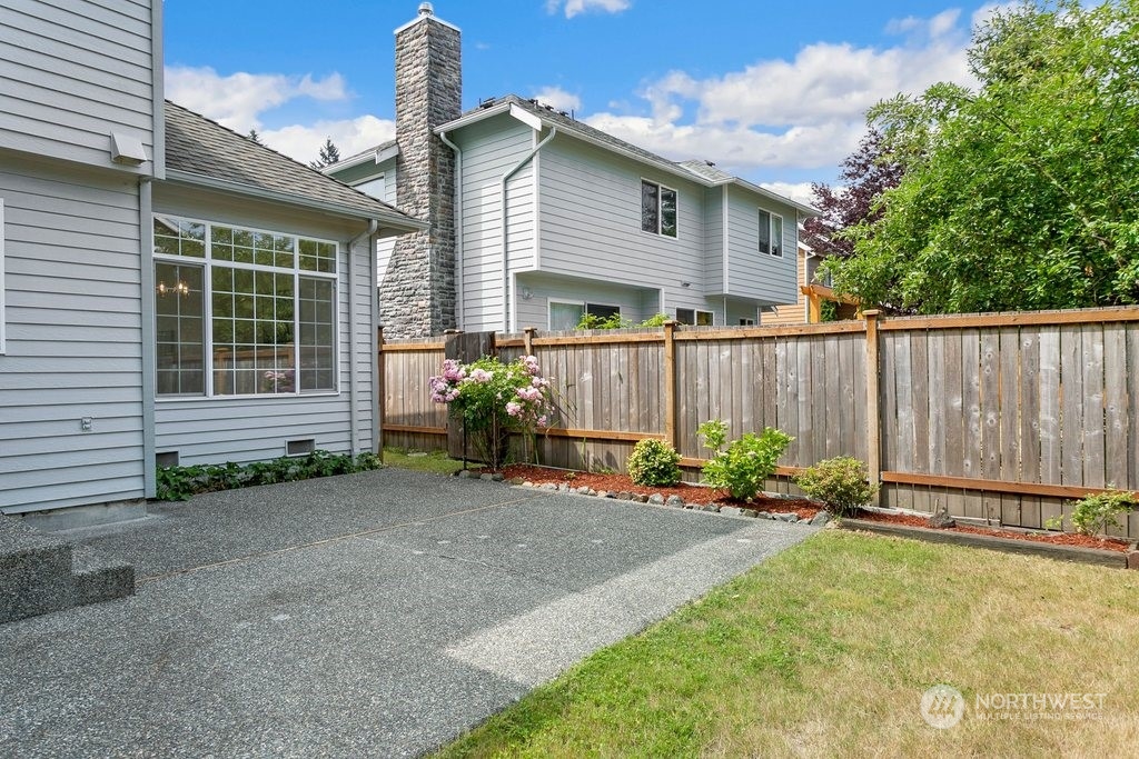 1315 231st Street Southeast Bothell, WA 98021 - Photo 32 of 34 a backyard of a house with table and chairs