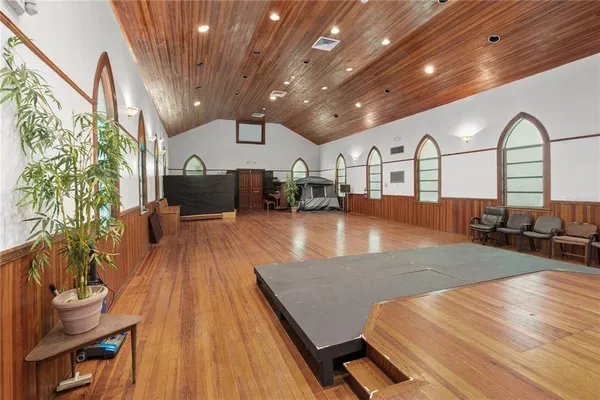 a storage room with wooden cabinets and appliances