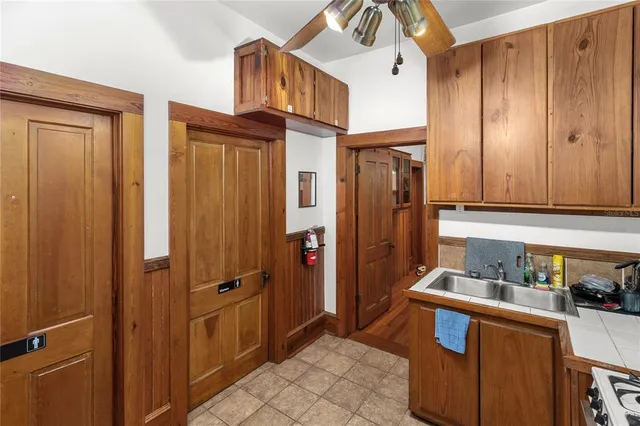 a bedroom with furniture and a large window