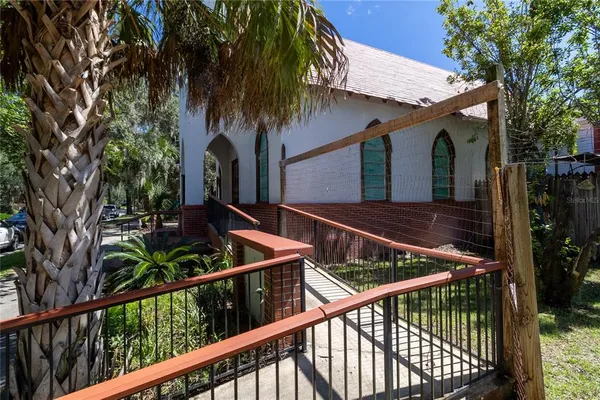 a view of a chair and table in backyard
