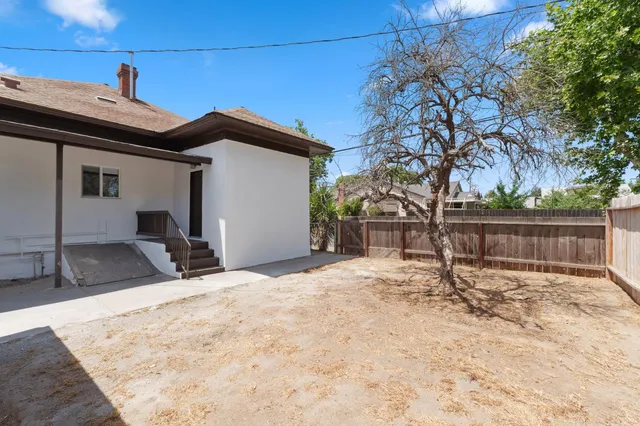 a view of a yard covered with snow in the background