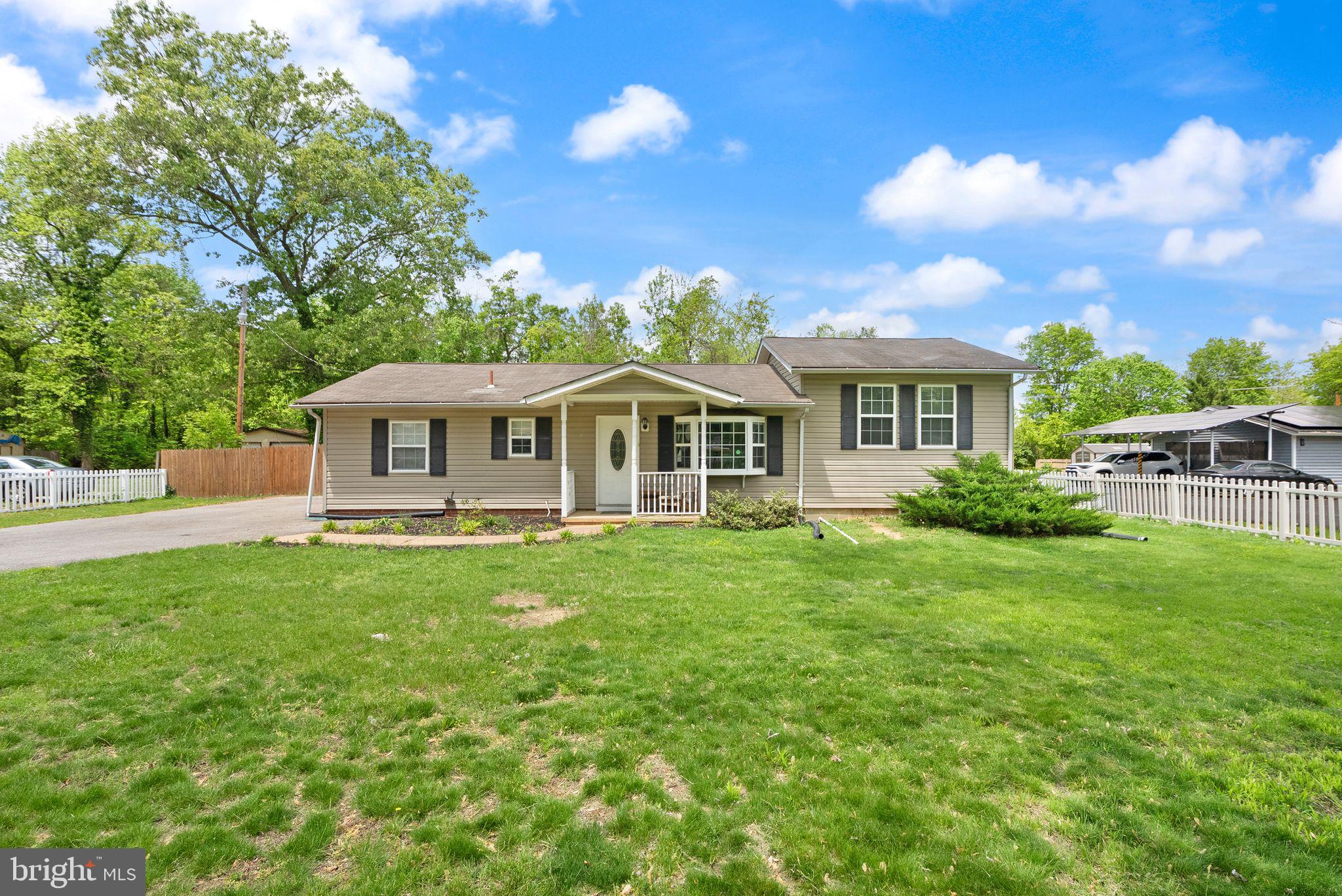 14501 Livingston Road Accokeek, MD 20607 - Photo 1 of 32 a front view of a house with yard and green space
