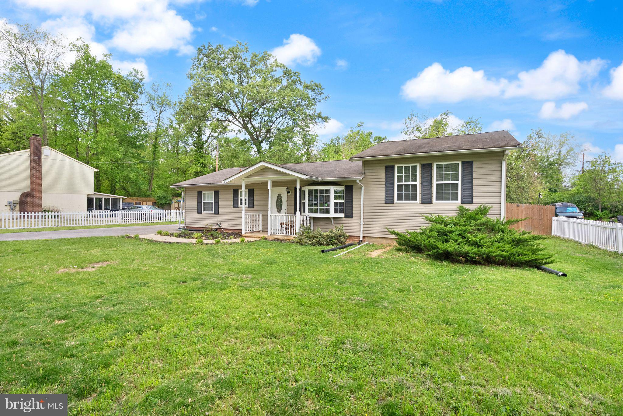 14501 Livingston Road Accokeek, MD 20607 - Photo 2 of 32 a view of house with yard and outdoor seating