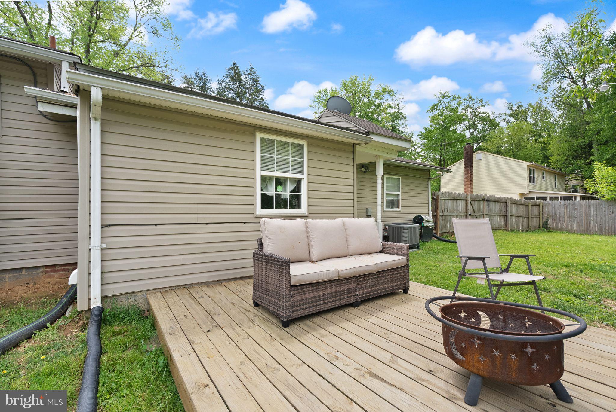14501 Livingston Road Accokeek, MD 20607 - Photo 25 of 32 a view of a patio with couches chairs and a yard