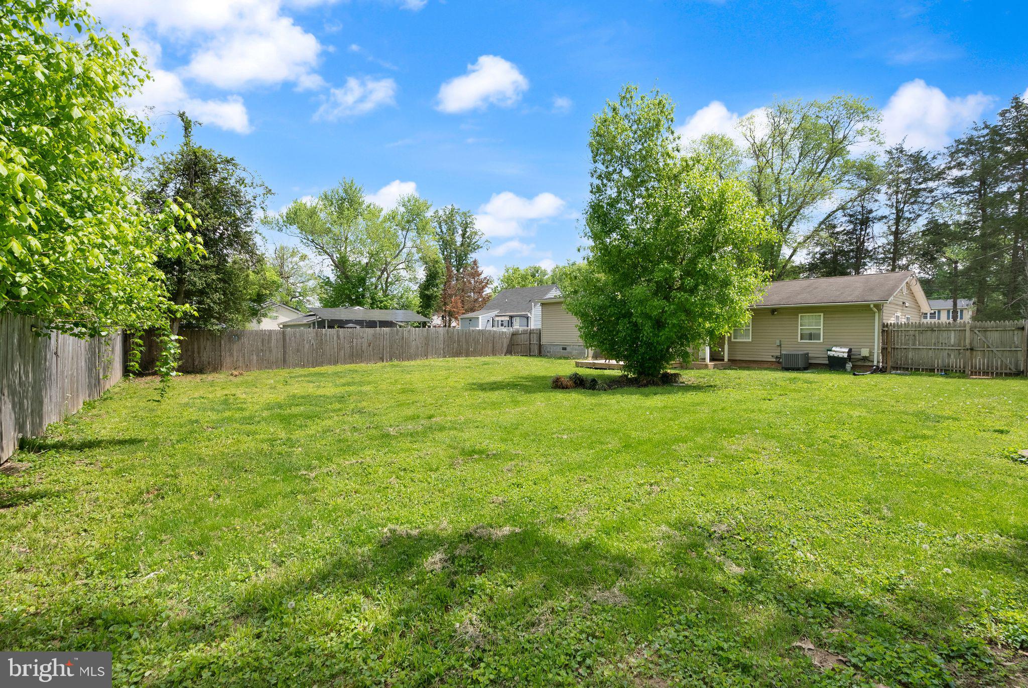 14501 Livingston Road Accokeek, MD 20607 - Photo 28 of 32 a view of a house with backyard and a tree